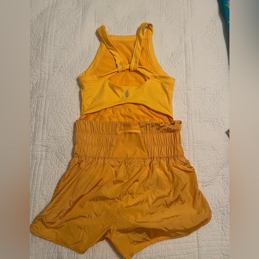 Free people movement high neck runsie in orange/yellow size S NEVER WORN